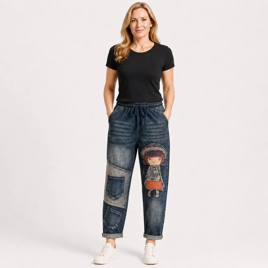 👖✨🍂 Női retro laza farmer hímzett díszítéssel és gumis derékkal – egyedi harem stílus (S-5XL, 2 szín)
