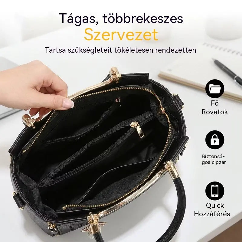 Női válltáska V-alakú varrással, arany szerelékekkel, több rekesszel és felső fogantyúval.